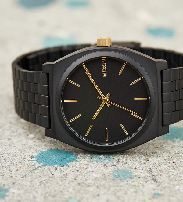 Nixon gold watch black face best sale